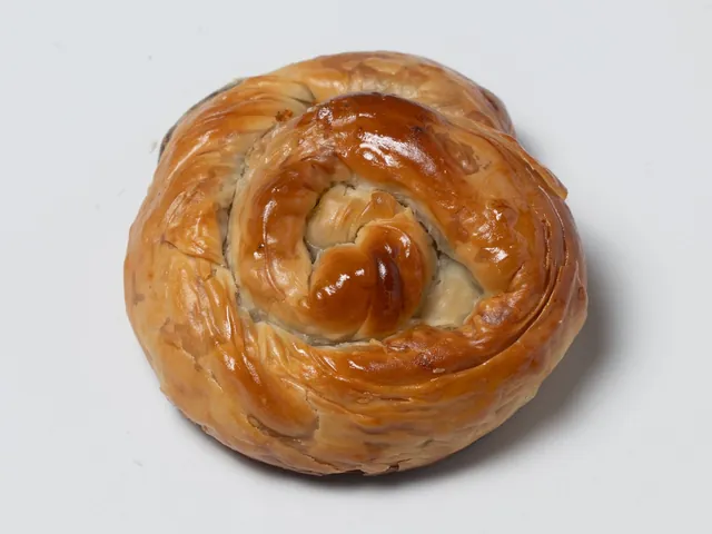 A golden spinach and cheese pastry roll