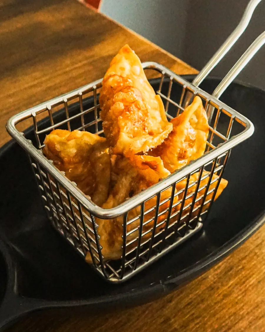 Crispy gyoza dumplings in a fry basket