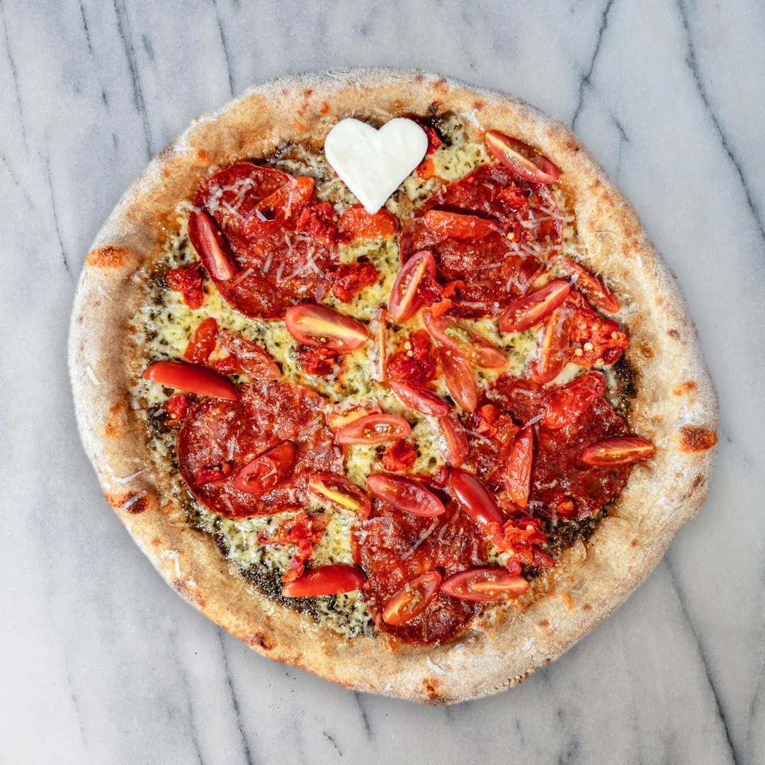Troubadour — pesto, mozzarella, spianata piccante, cherry tomatoes, roasted garlic and Calabrian chili oil — Leolo Pizza Open Mic Series