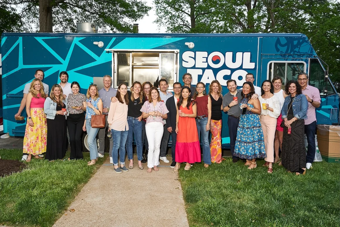 Private event group photo in front of the Seoul Taco truck
