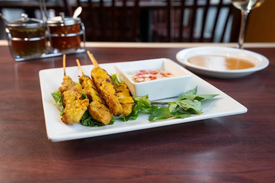 Chicken satay skewers with dipping sauces