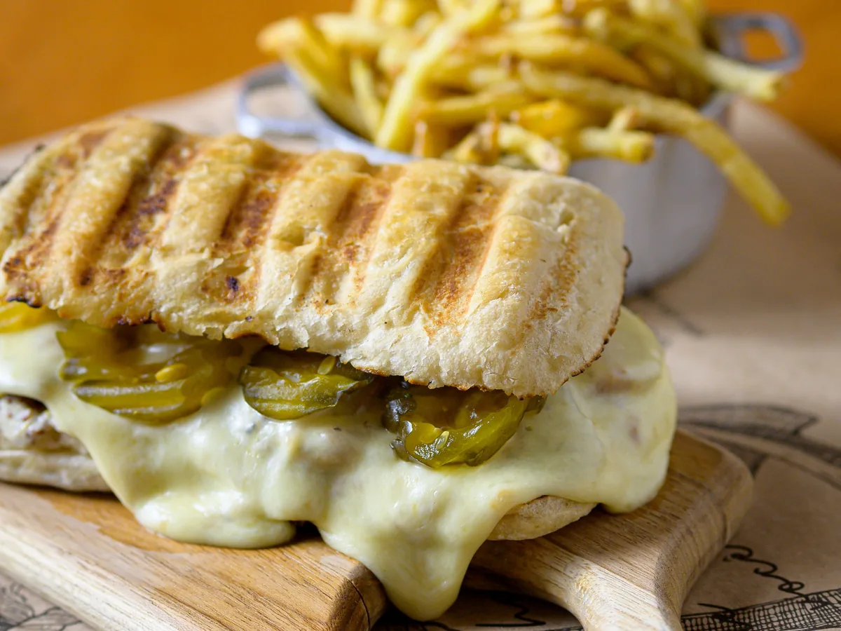 A hot lunch melt on the pass