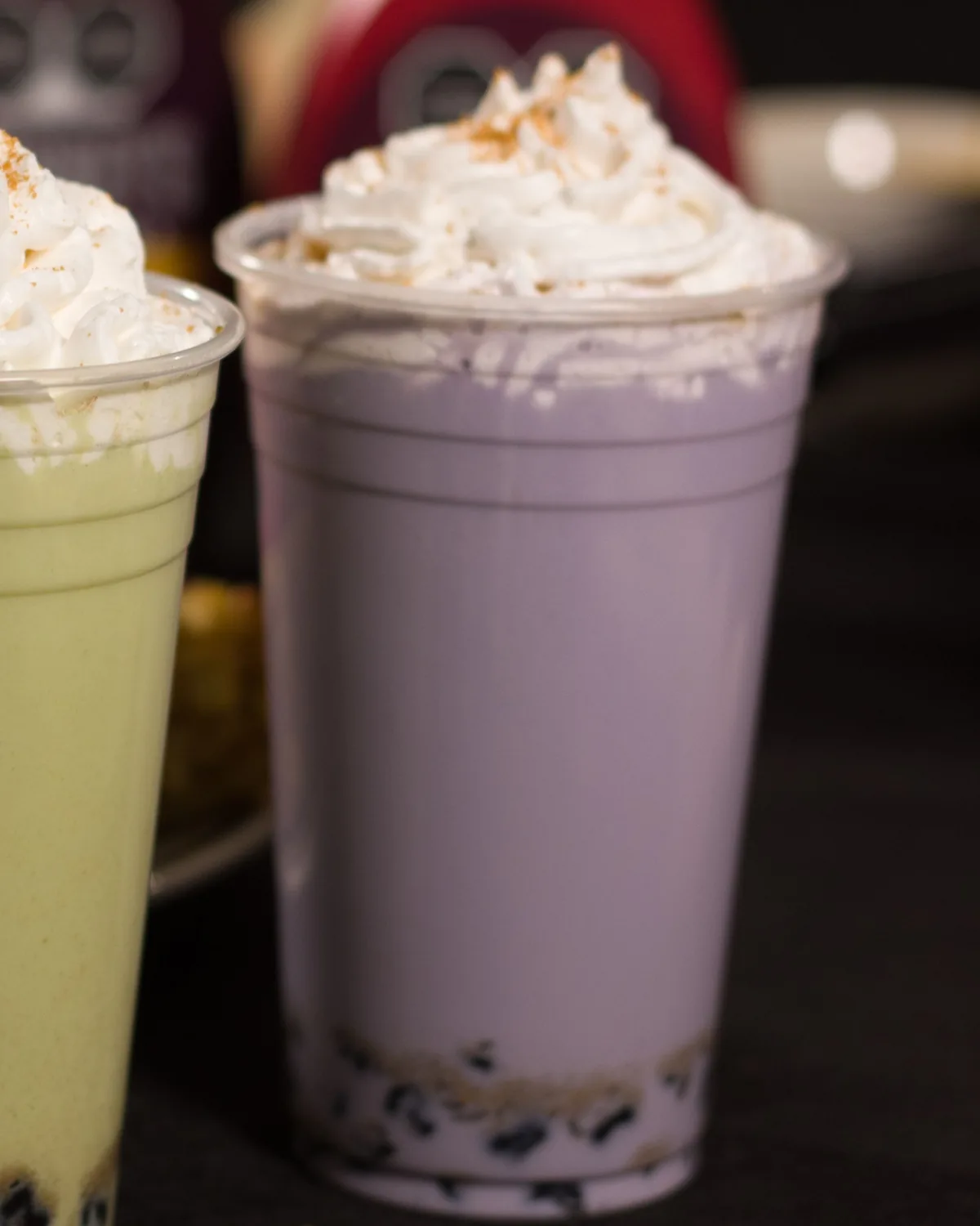 A taro milk tea layered over house-cooked boba pearls