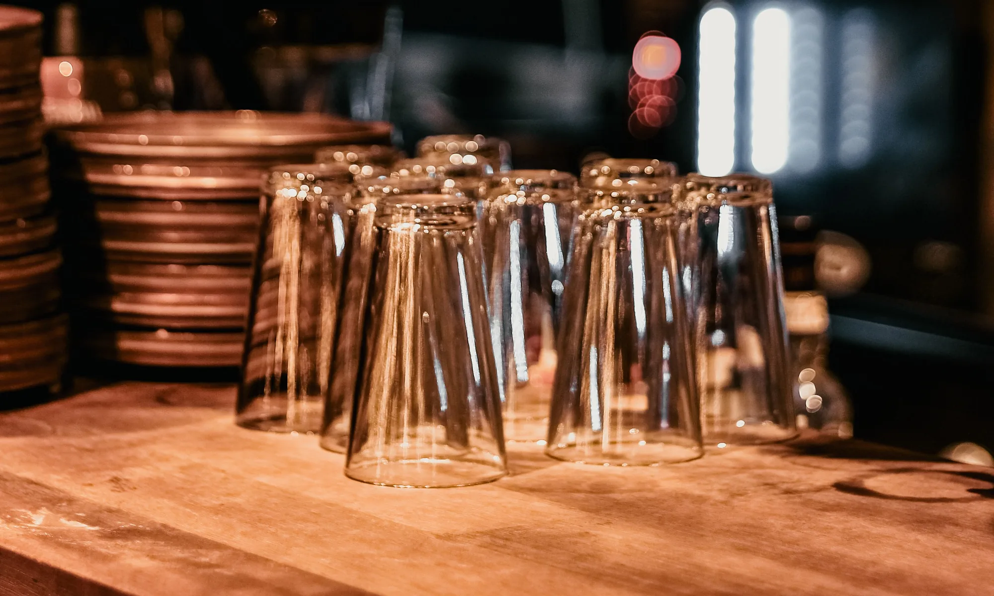 Counter detail — walnut top and stacked glasses