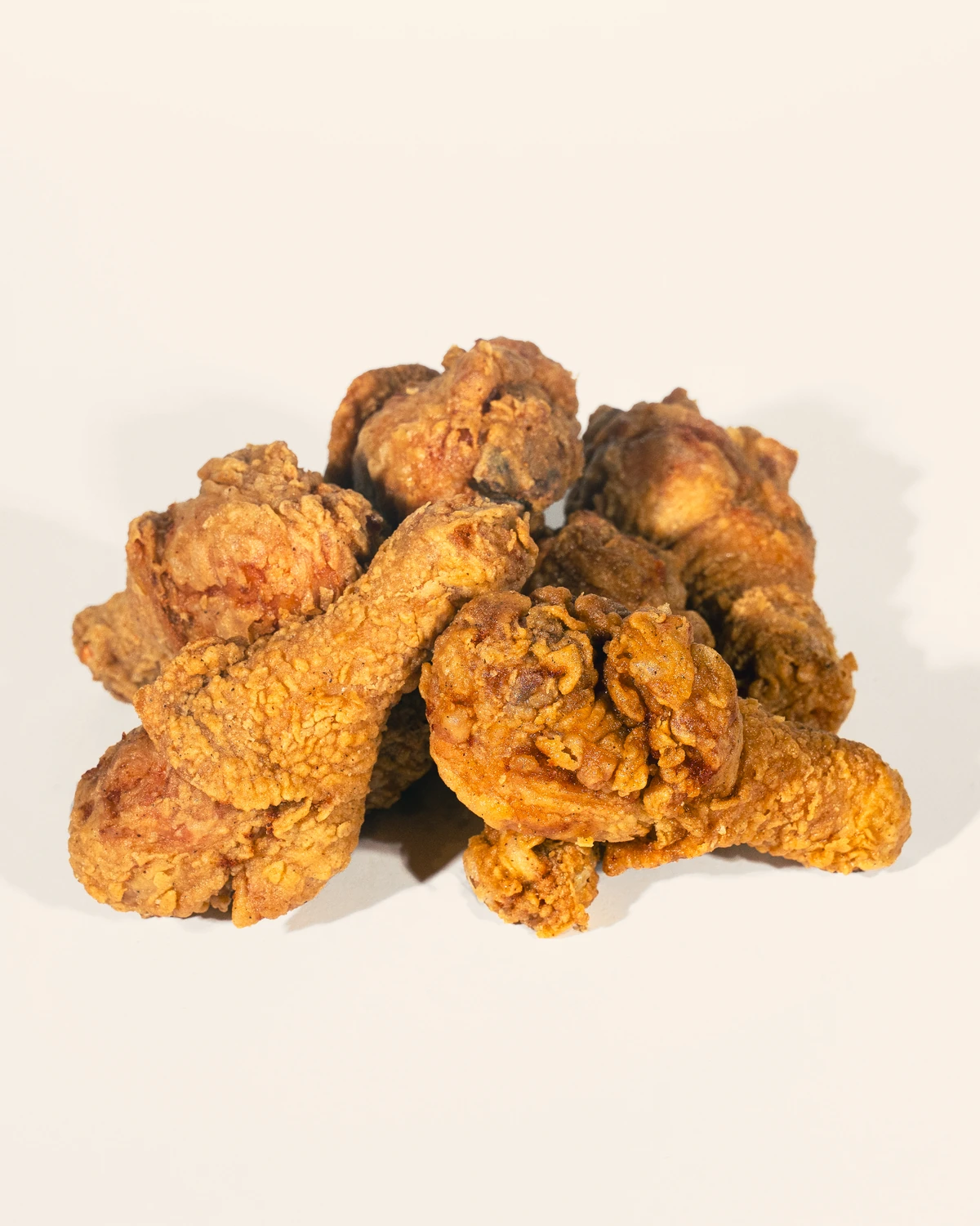 A full Ugly Chicken feast — wings, drummies, sandwiches and sides